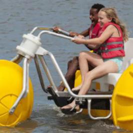 a person with a small boat in a body of water